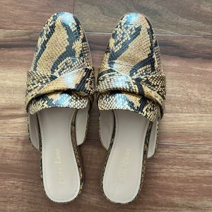 Lightly worn snakeskin mules